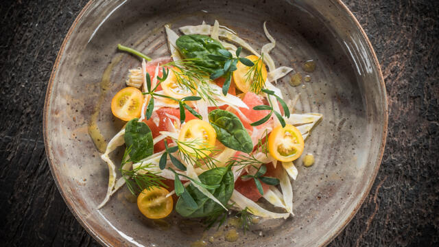 Open lasagna of watermelon, fennel carpaccio, dill, baby spinach, ricotta, yellow cherry tomato and lemon