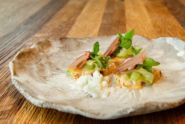 Marinated yellowfin mackerel, cucumber, buttermilk and Hippo Tops