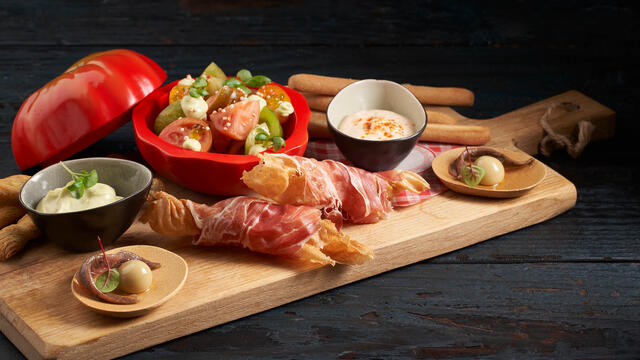 Tomato salad with crunchy nut almond and ham