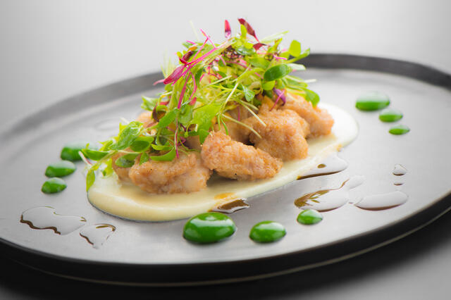 Lamb sweetbreads with cinnamon flowers, celery cream, honey salad and wheatgrass