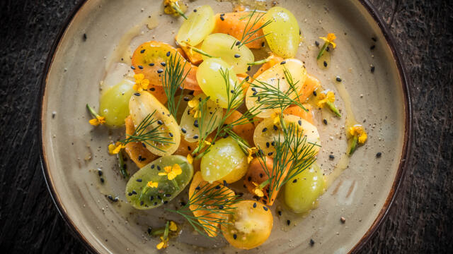 Salad of yellow grapes and sweet potato, black sesame, dill, lime, yellow cherry tomato and Anise Blossom