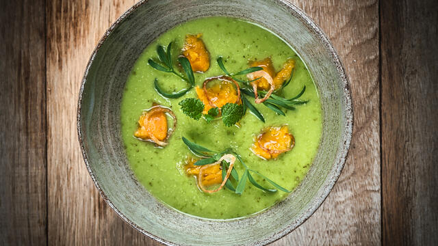 Pea soup with lemon balm, fried shallots, sweet potato and Sea Fennel