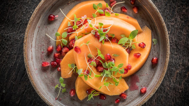 Ripe melon with pomegranate and Limon Cress