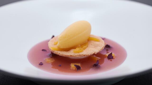 Hand-beaten mascarpone, yellow peach with Shiso and hazelnut sable