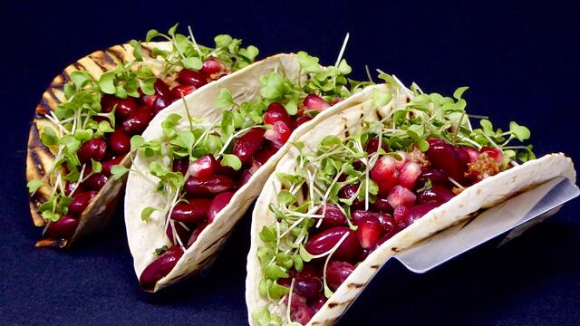 Chili con carne and pomegranate tacos